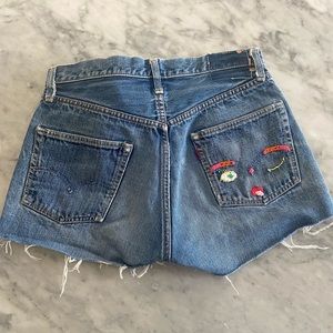 Vintage Levi’s cut-off shirts with hand sewn design. From the 1960’s.